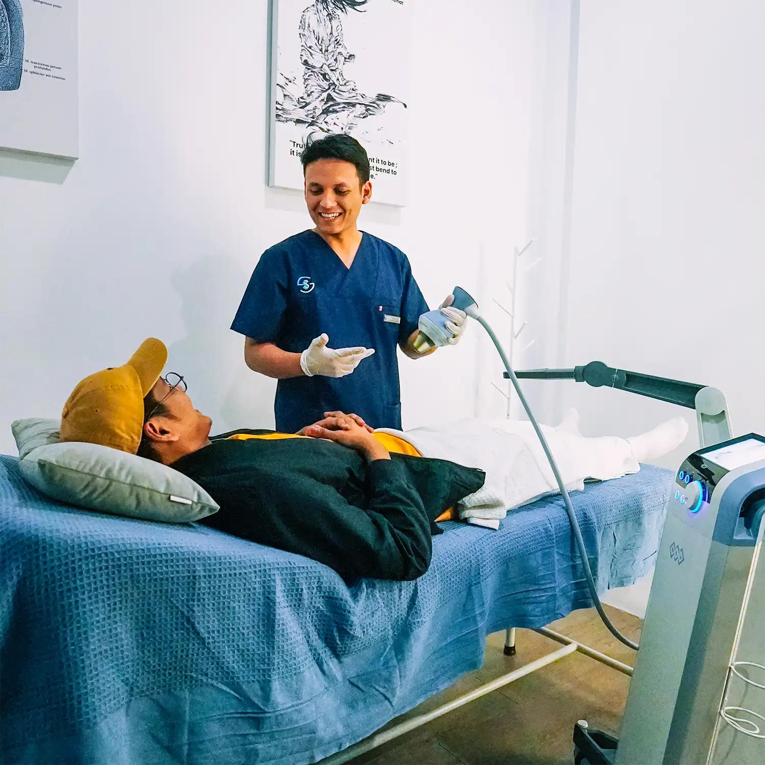 Medical Assistant Perform Shockwave Therapy at SuamiSihat Clinic